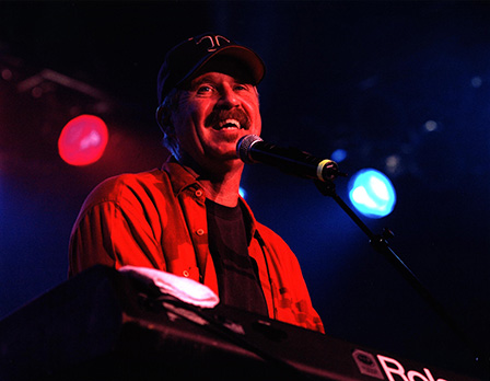 man singing into microphone