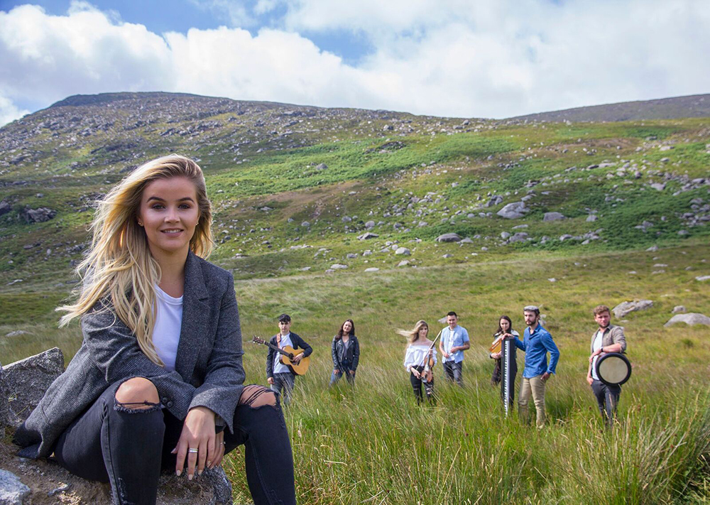 The Young Irelanders standing in a grassy plain