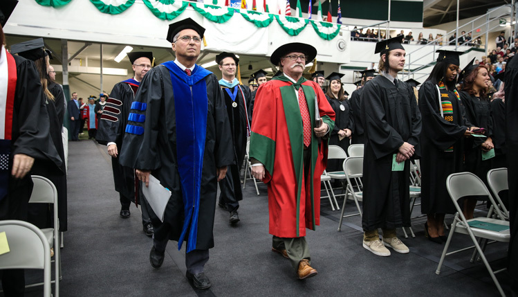 The college deans walk in