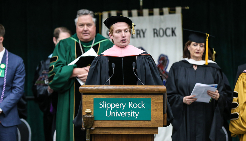 Singer performs the alma mater