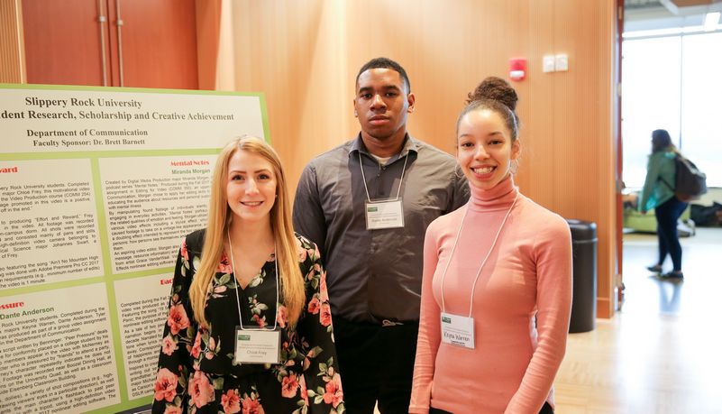 Student researchers smiling