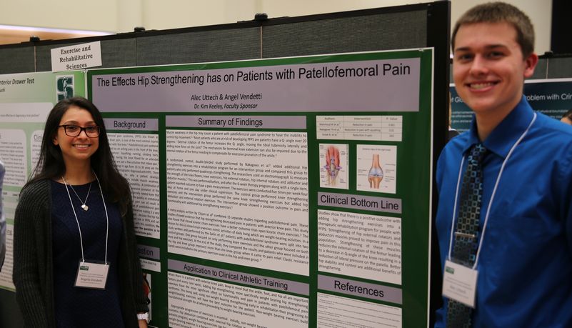 Proud students showing their findings related to patellofemoral pain