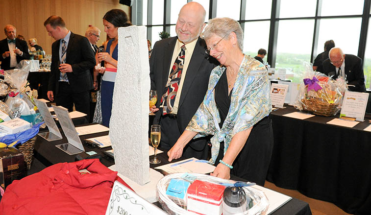 Gala attendees at a silent auction