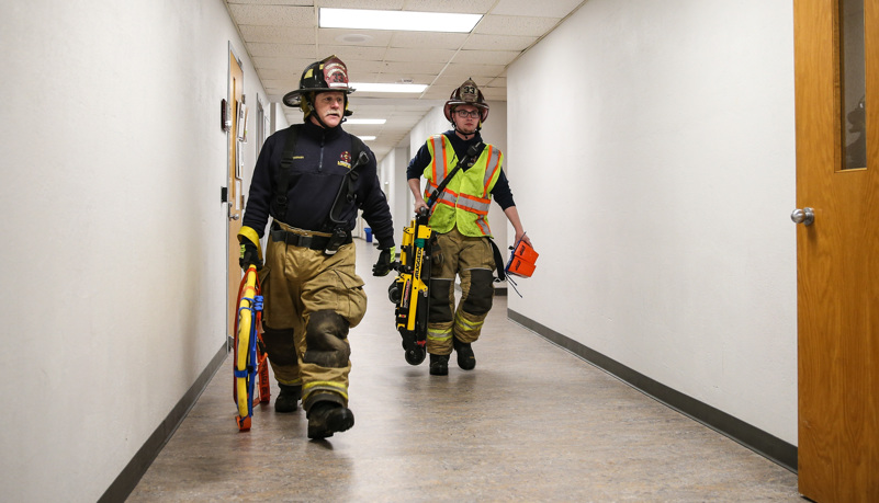 Firemen evacuate the injured