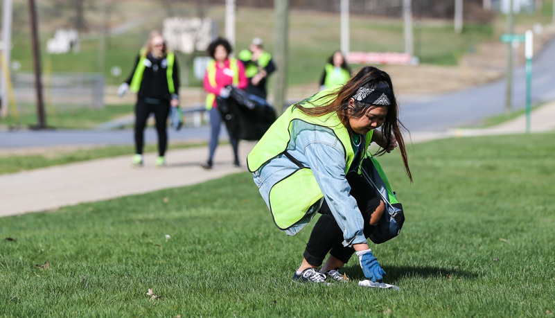 Woman picking up trash