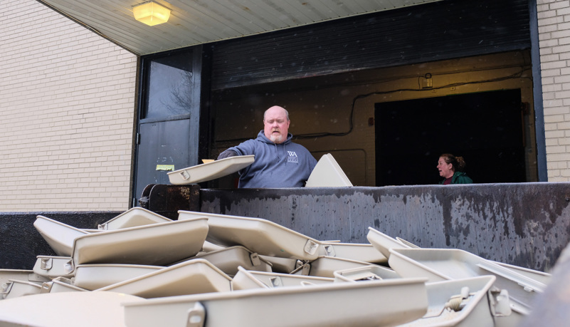 Seats disposed of in a dump truck