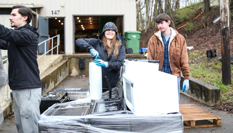 Students packing recycled electronics