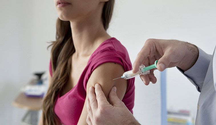 Woman receiving a vaccine