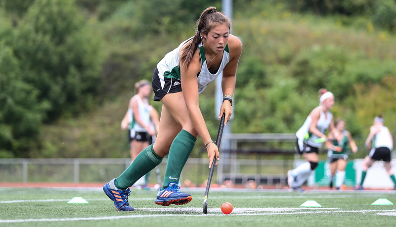 Woman playing field hockey