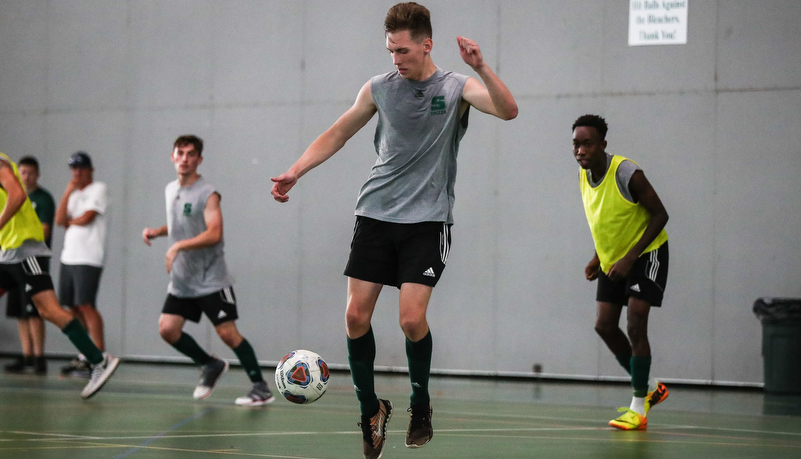 Men playing soccer