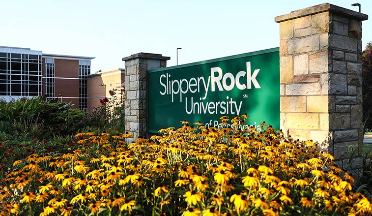 Campus sign with flowers