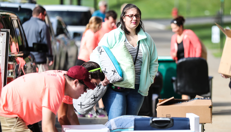 A freshmen makes a final check of her stuff