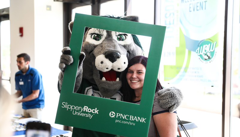 Rocky poses with a student