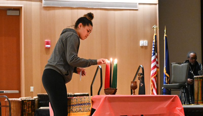 Woman lighting a candle