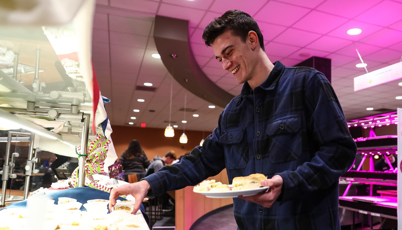 Student selecting a desert