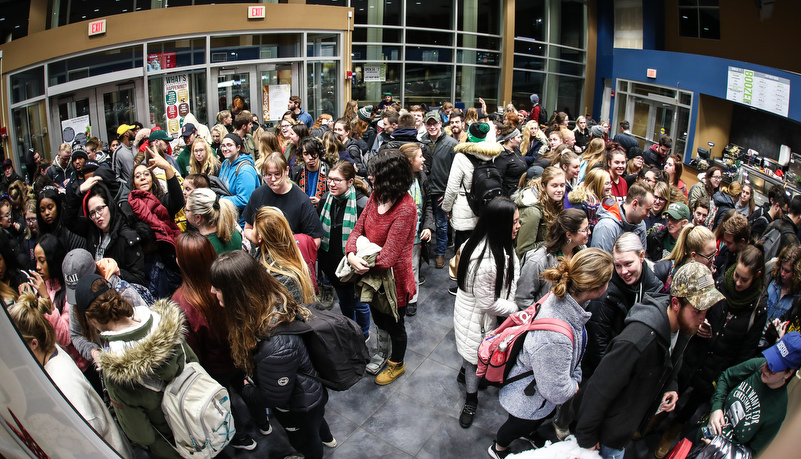 the crowd of students waits to get in