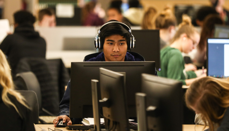 Male student working on a computer