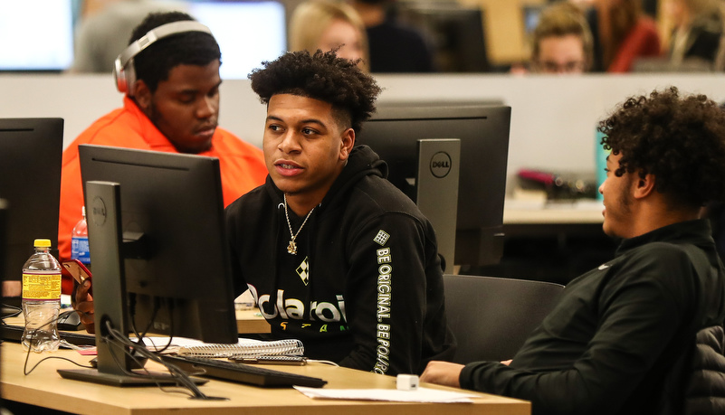 Male student working on a computer