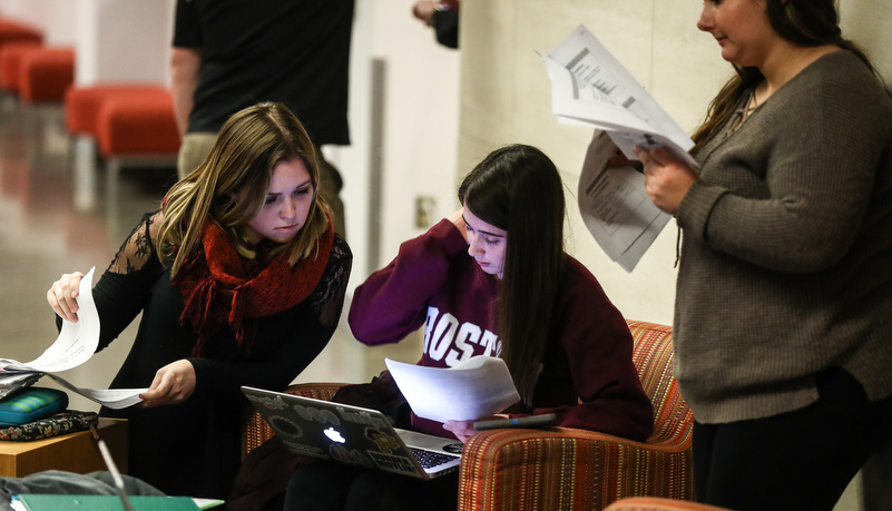 Woman reviewing material in a group