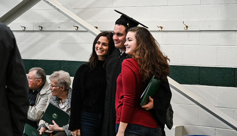 Gradutes pose for a photo