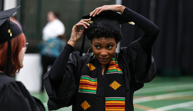 woman adjusts her cap