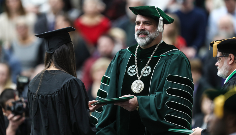 President hands out a diploma