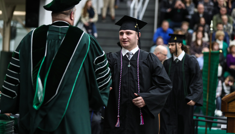 President hands out a diploma