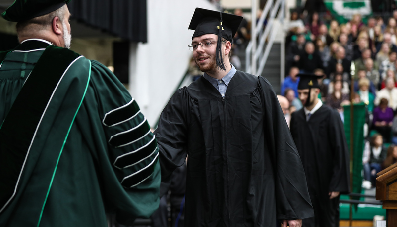 President hands out a diploma