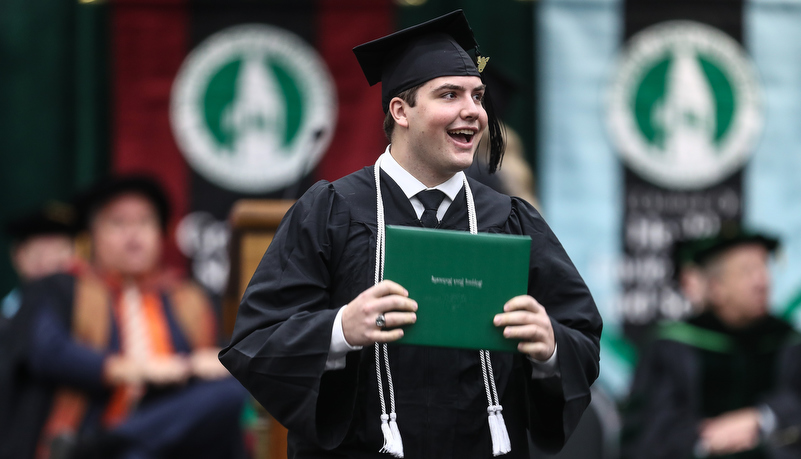 Graduate with his diploma