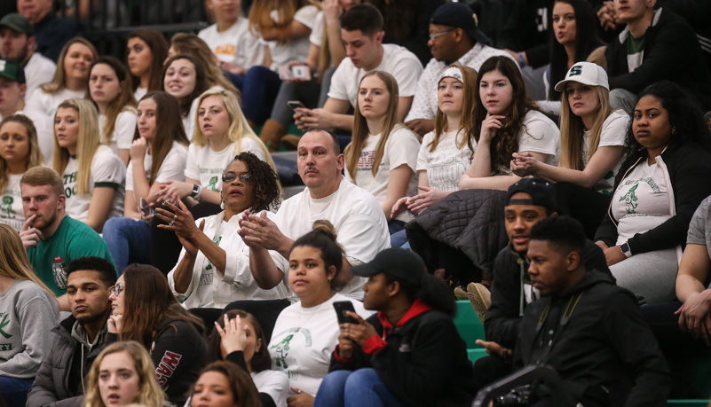 Fans cheer on the Rock