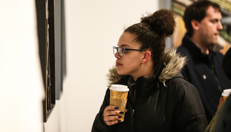 Woman looking at art