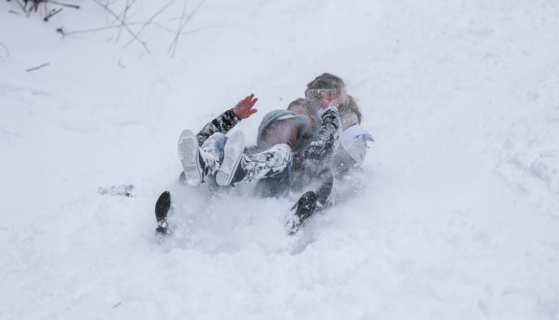 Students sled riding