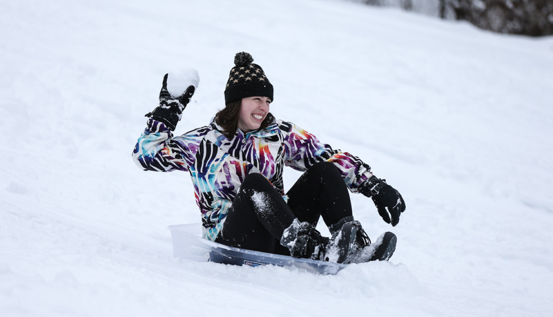 Students sled riding