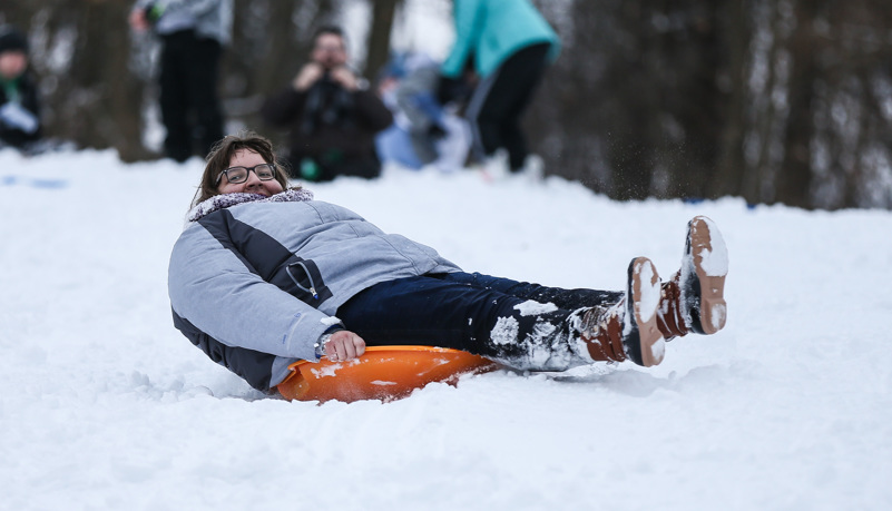 Students sled riding