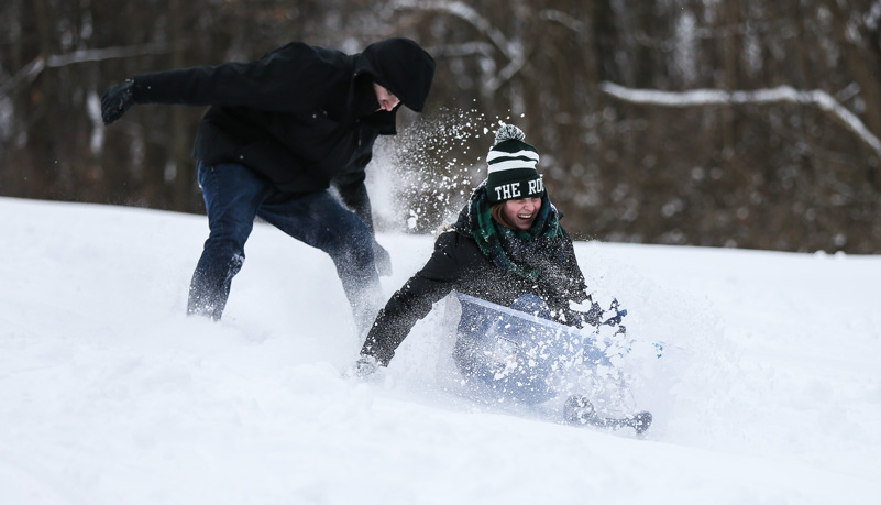 Students sled riding