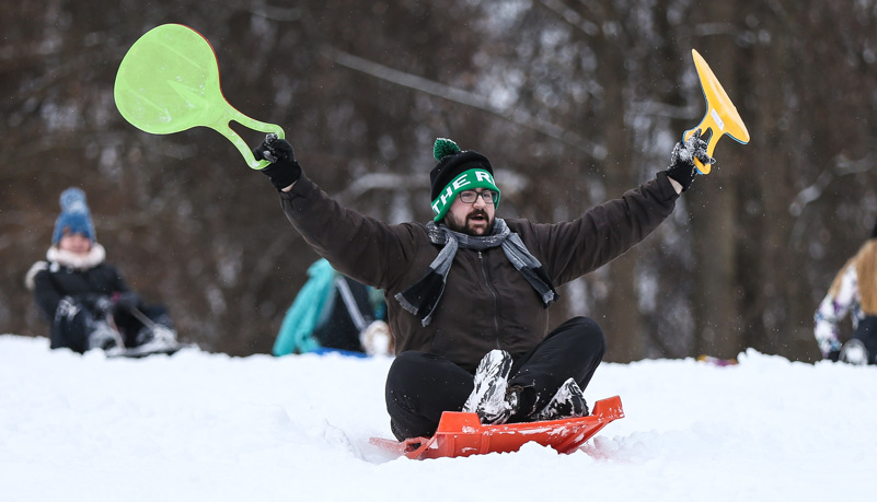 Students sled riding