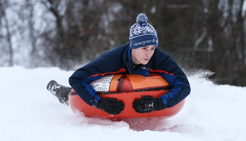 Students sled riding