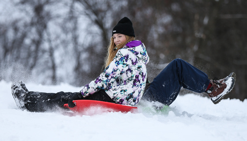 Students sled riding