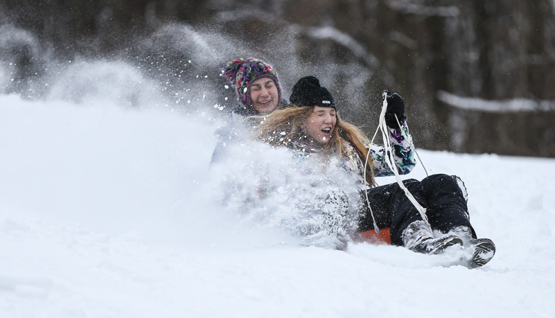 Students sled riding