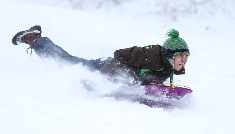 Students sled riding
