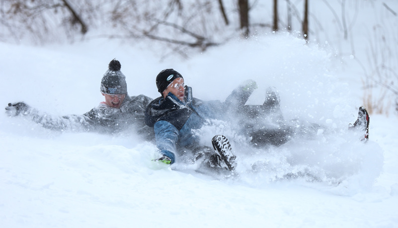 Students sled riding