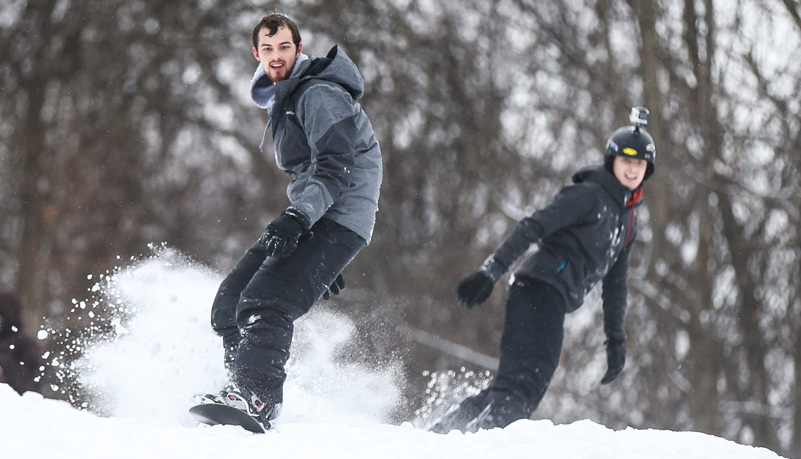 Students sled riding