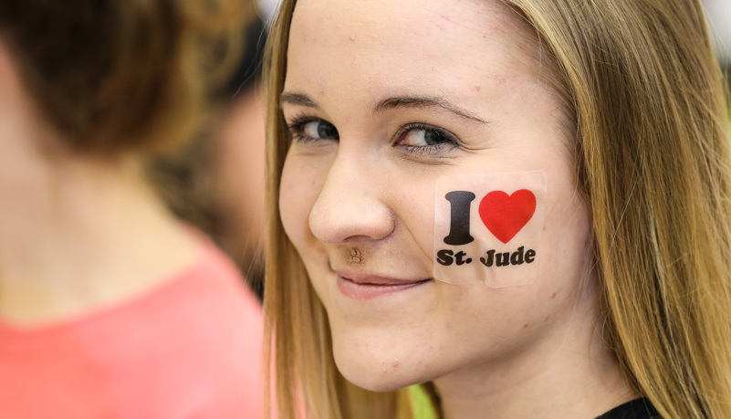 Woman with St Jude logo on cheek