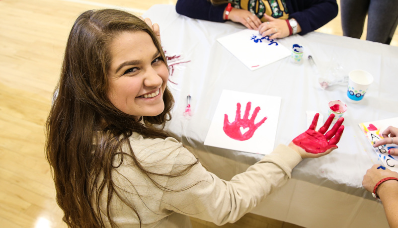 Woman with paint on her hand