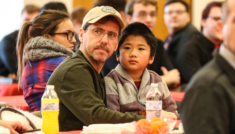 Man and Chinese boy together