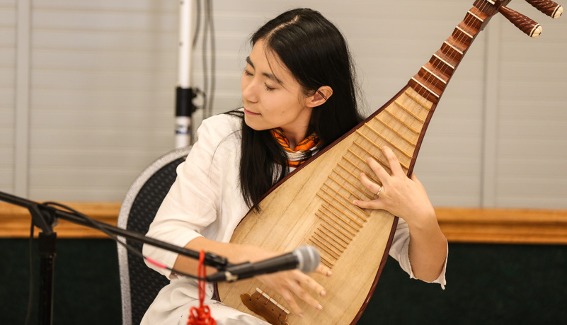 Woman playing traditional Chinese music