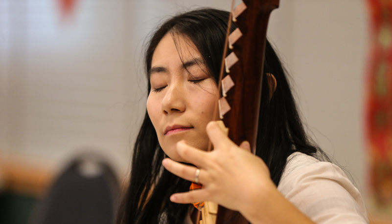 Woman playing traditional Chinese music