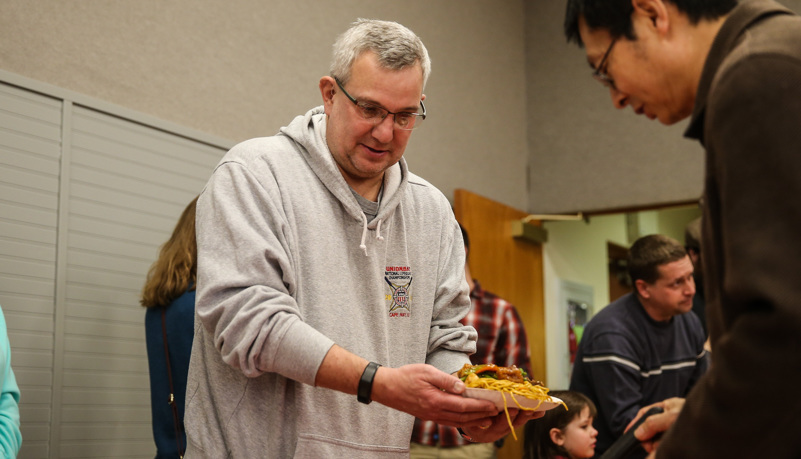 Man selecting Chinese food