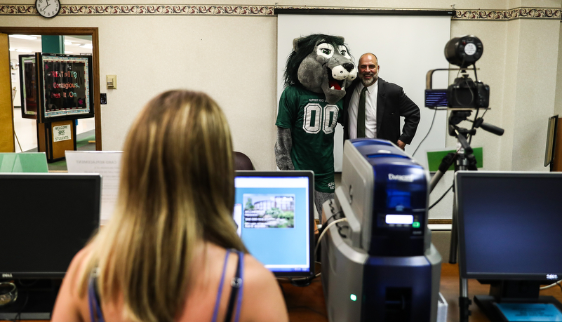 President Behre getting his ID photo taken