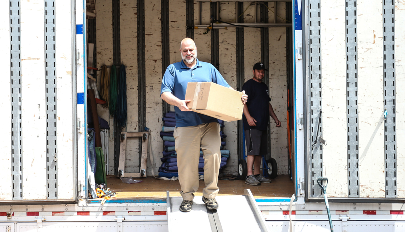 Dr. Behre unloading a box